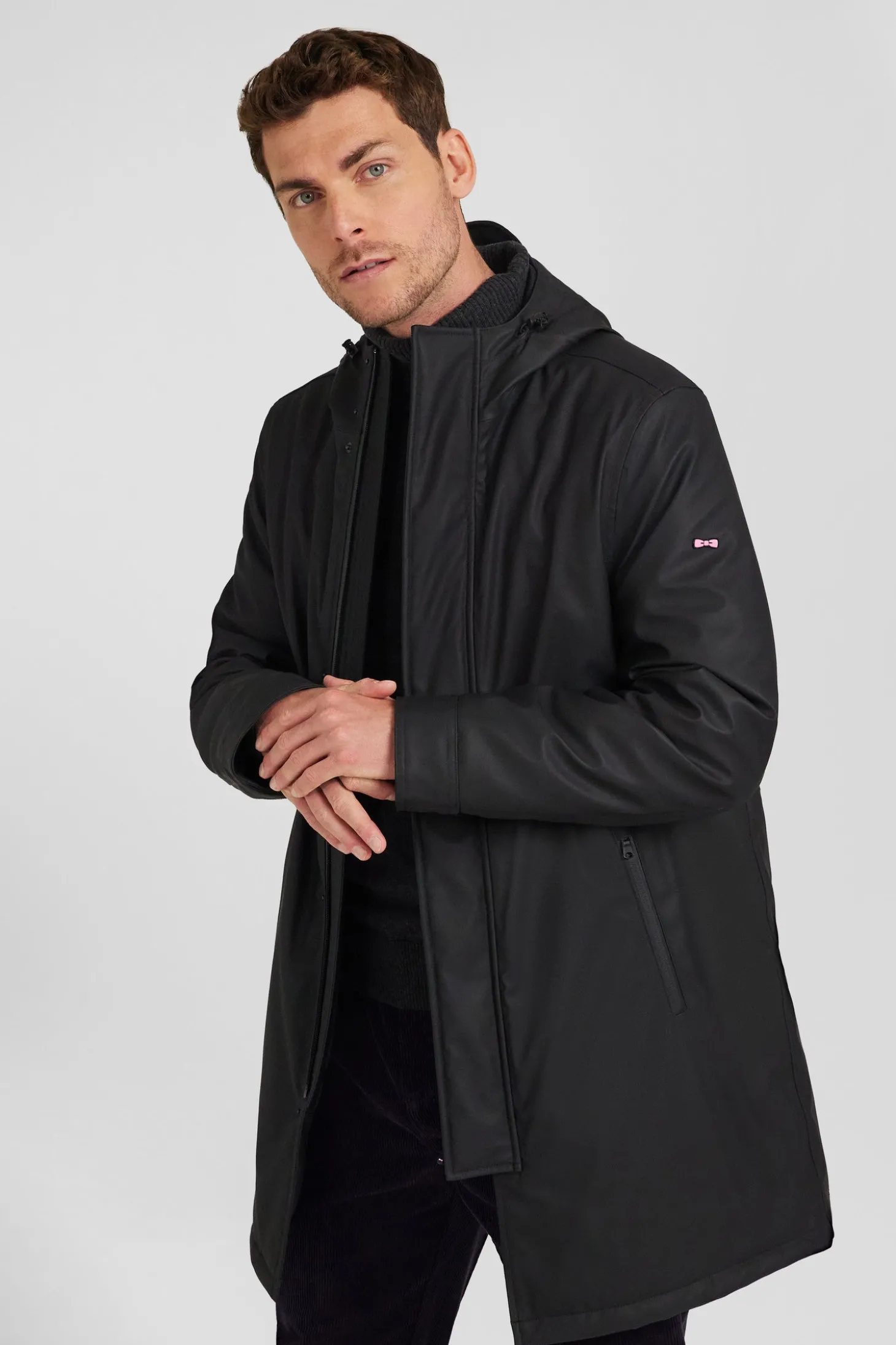 Black hooded raincoat