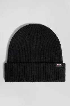 Black knitted beanie with bow tie embroidery