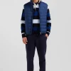 Blue quilted sleeveless high collar down vest