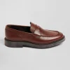 Brown polished leather loafers