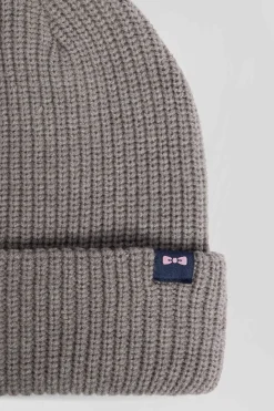 Mottled grey knitted beanie with bow tie embroidery