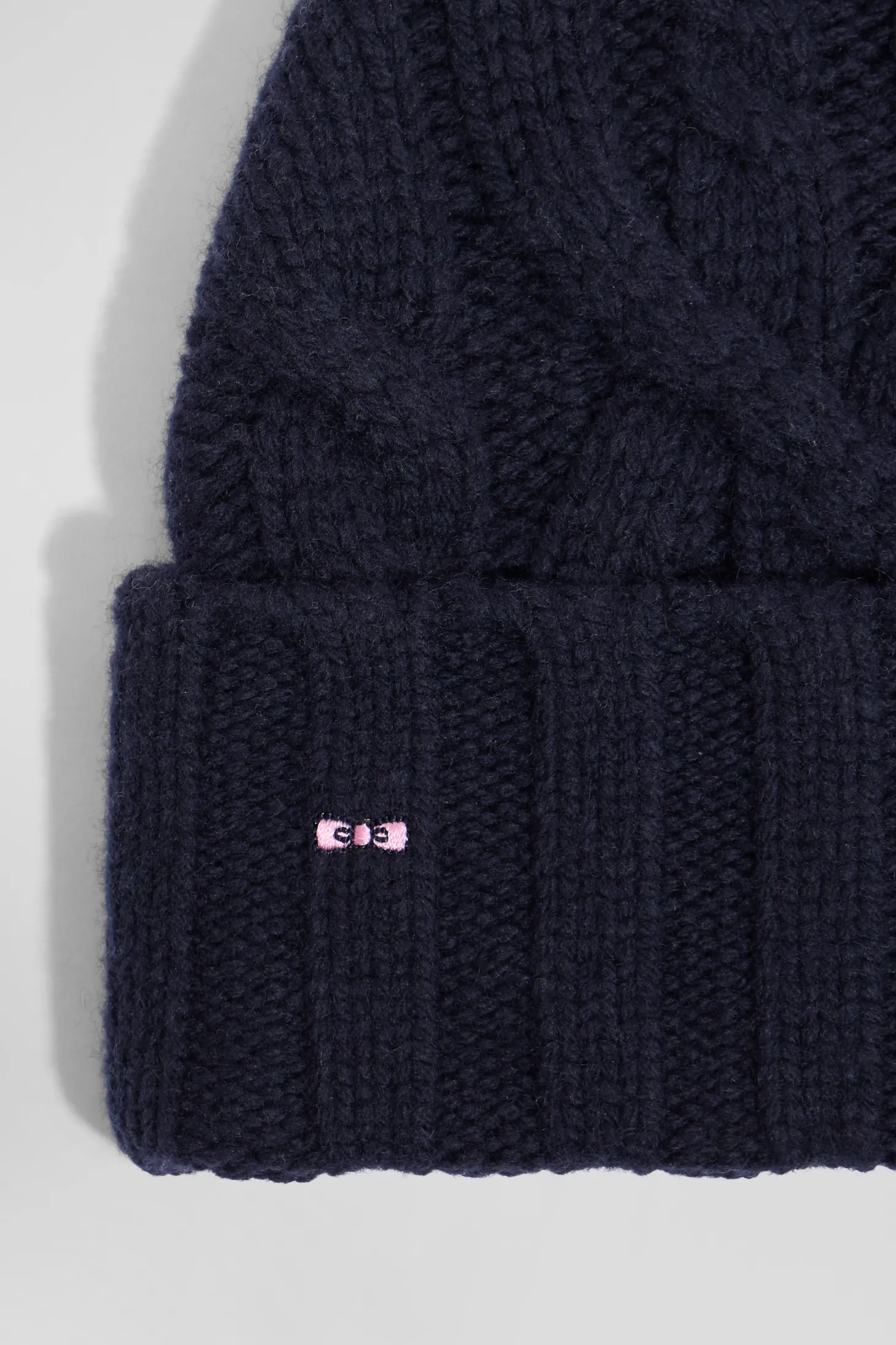 Navy blue cable knitted wool beanie