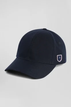 Navy blue cap with rubber badge and tricolour trim