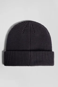Navy blue knitted beanie with bow tie embroidery