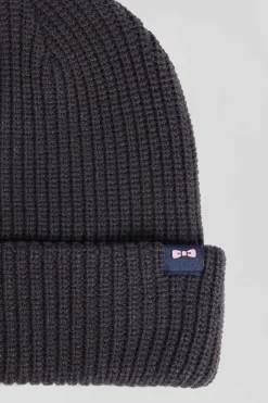 Navy blue knitted beanie with bow tie embroidery