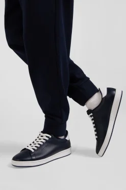 Navy blue low-top leather sneakers