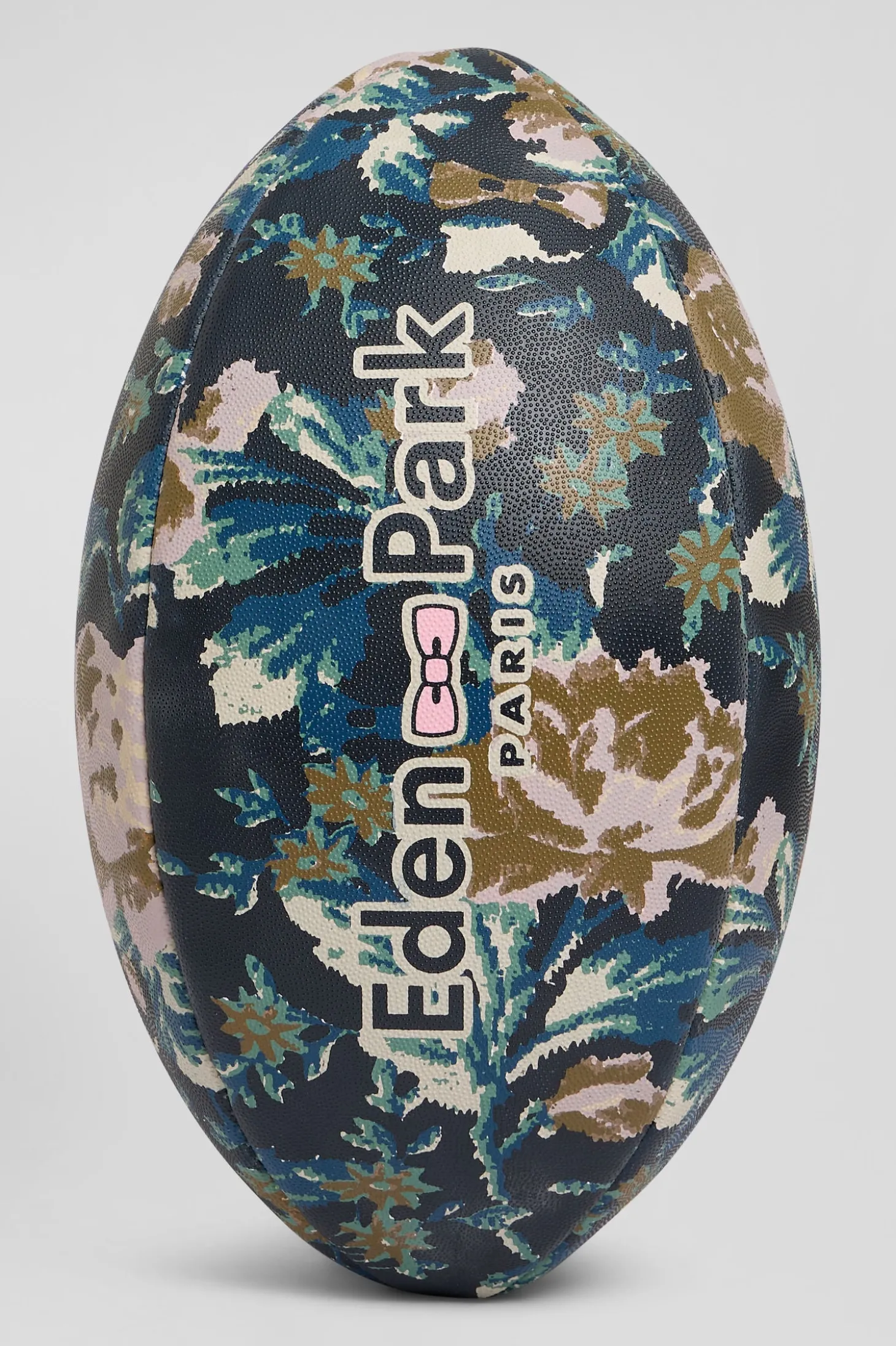 Navy blue rugby ball with floral motifs