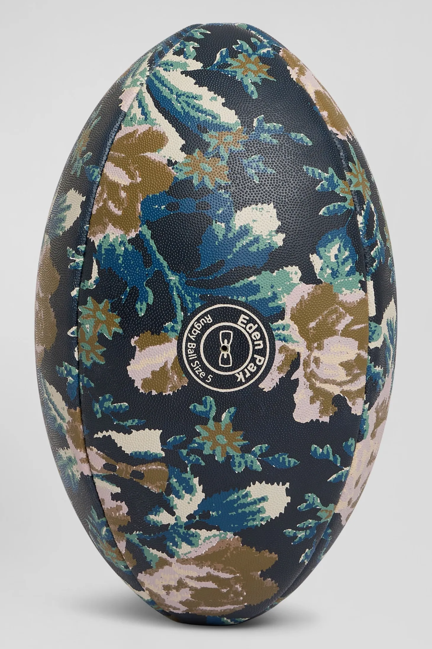 Navy blue rugby ball with floral motifs