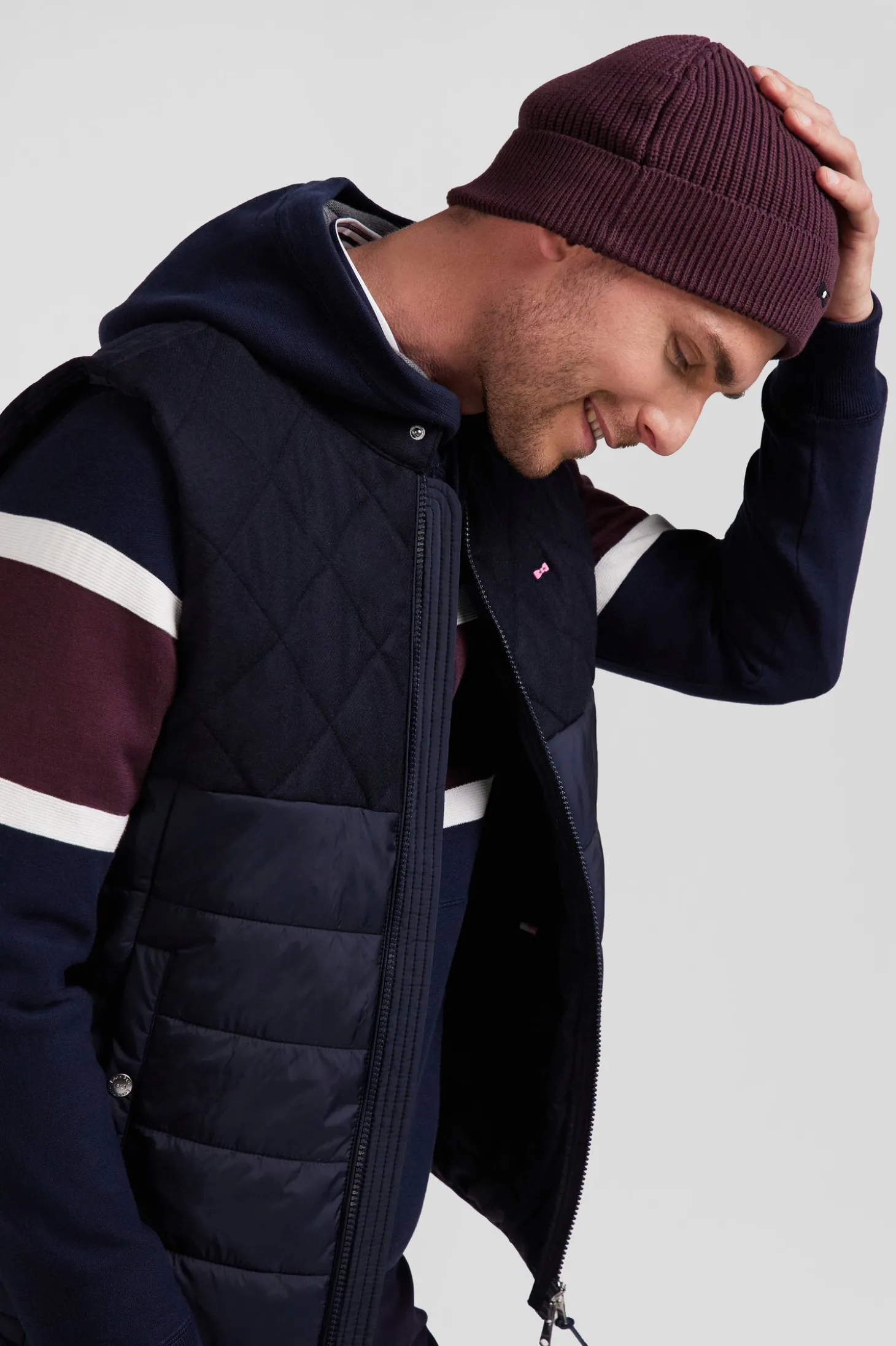 Navy blue sleeveless double quilted high collar down vest