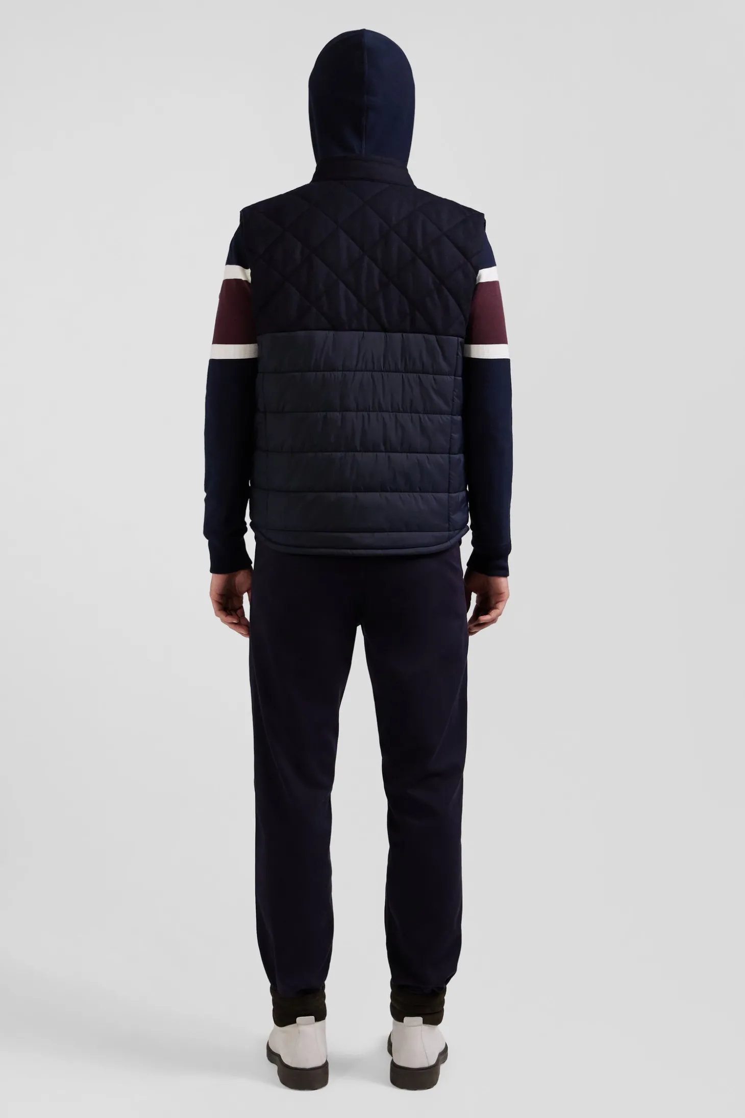 Navy blue sleeveless double quilted high collar down vest