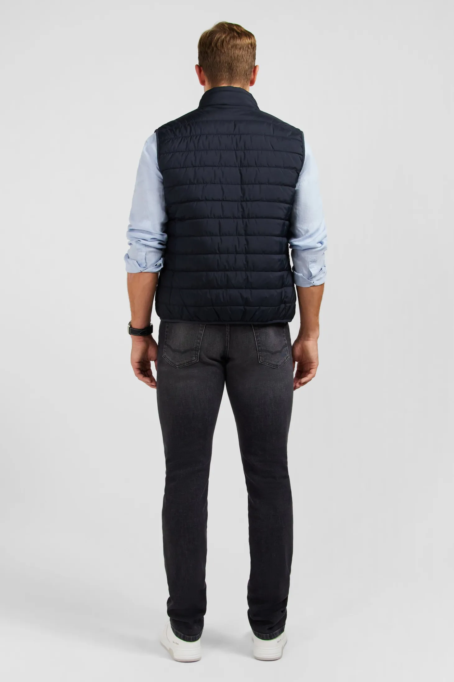 Navy blue sleeveless puffa jacket