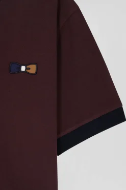 Oversized burgundy short-sleeved cotton piqué polo shirt with tricolour collar