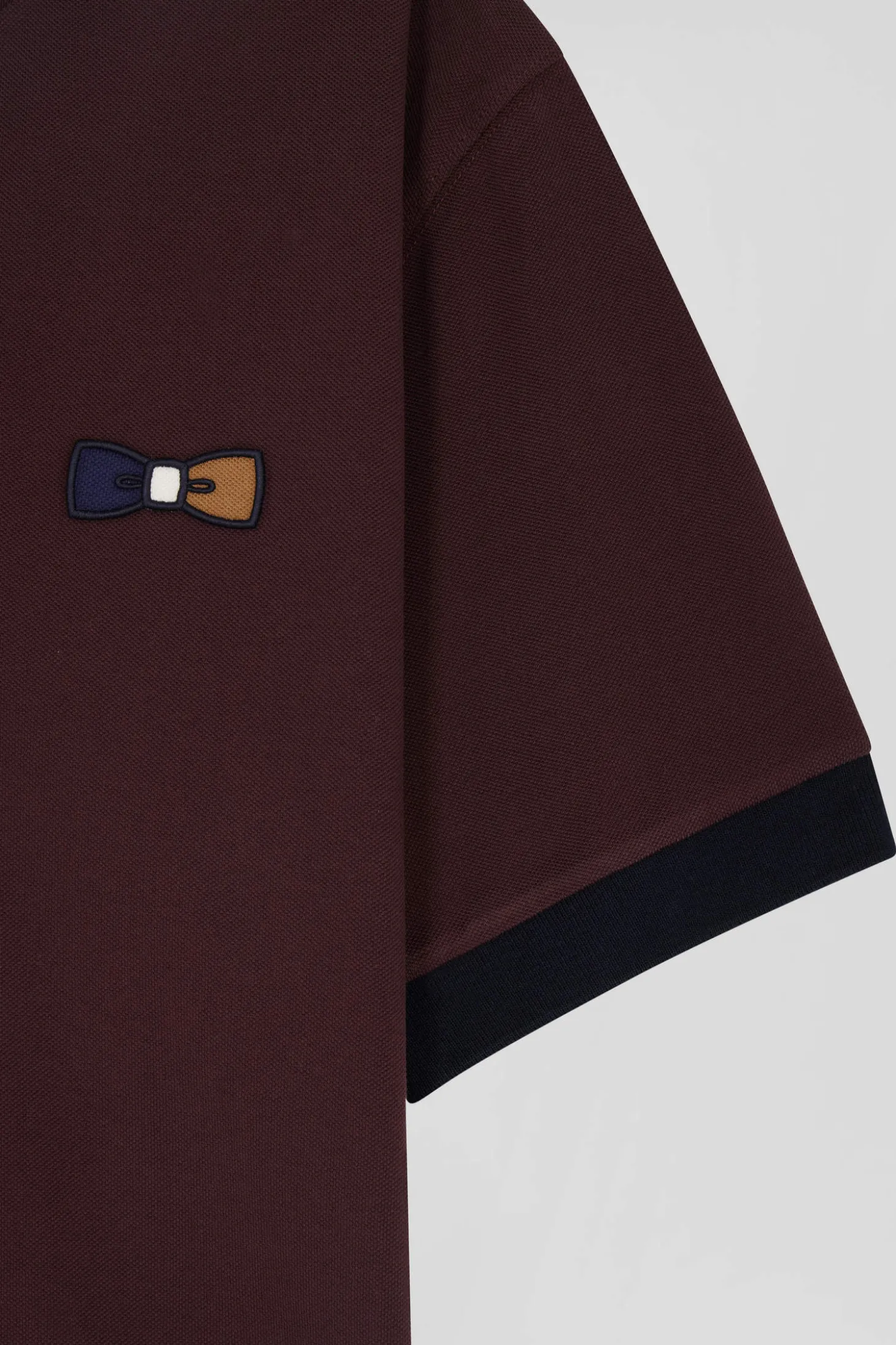 Oversized burgundy short-sleeved cotton piqué polo shirt with tricolour collar
