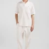 Oversized ecru unisex short-sleeved cotton piqué polo shirt