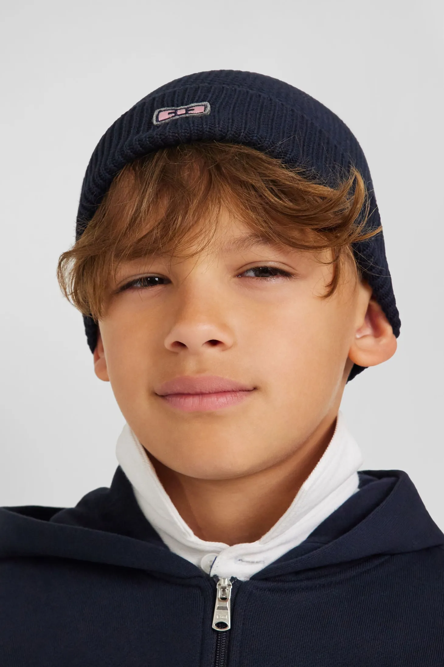 Plain navy blue cotton beanie with bow tie embroidery