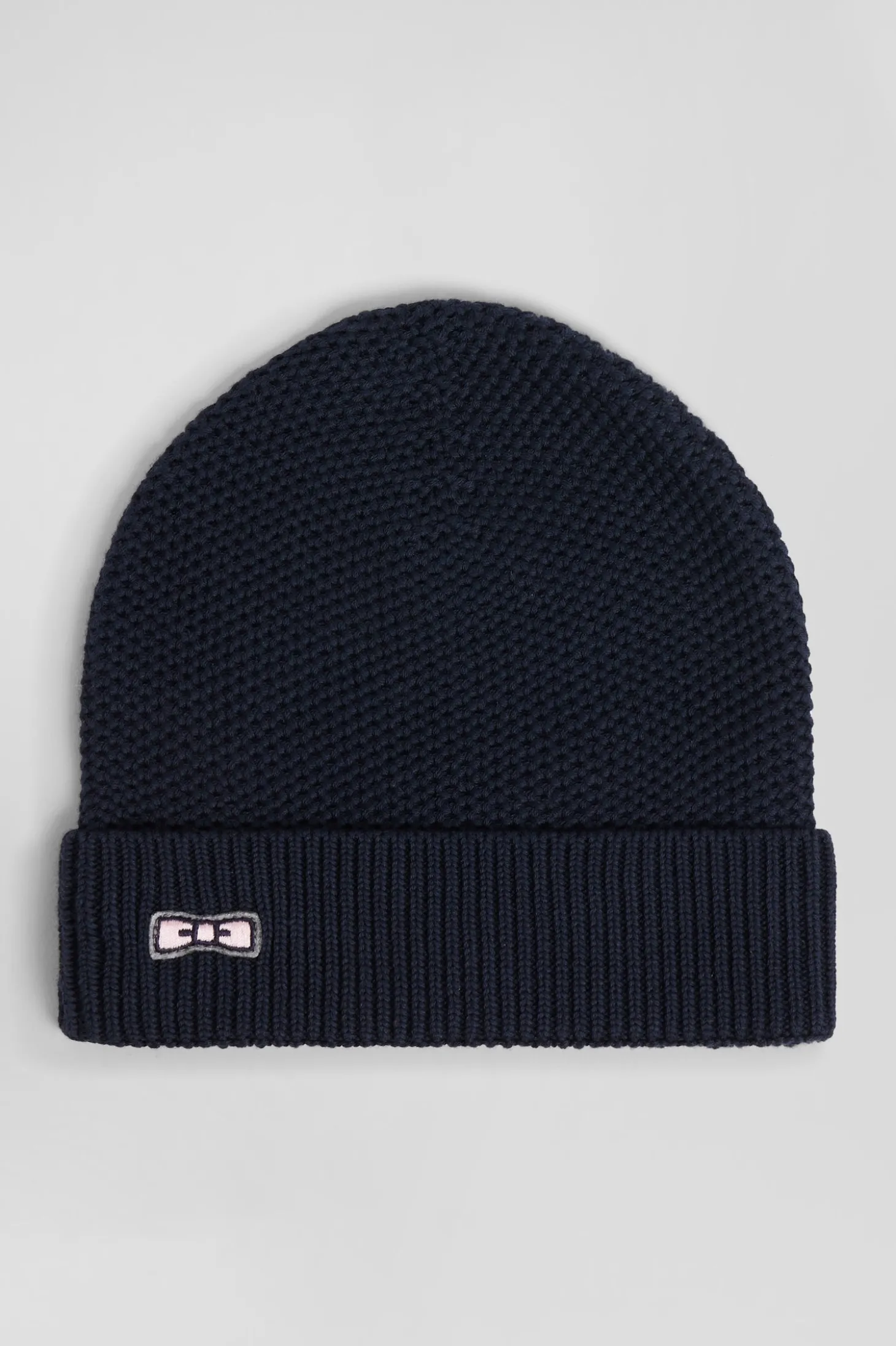 Plain navy blue cotton beanie with bow tie embroidery