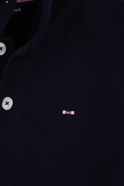 Regular navy blue short-sleeved cotton piqué polo shirt with back bow tie embroidery