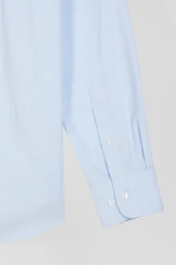 Regular plain sky blue cotton shirt with button-down collar and chest pocket