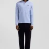 Regular sky blue long-sleeved cotton piqué polo shirt with rubber badge