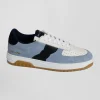 Sky blue low-top leather sneakers with navy blue cut-out