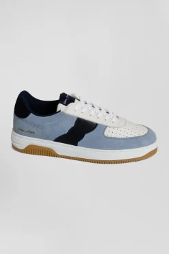 Sky blue low-top leather sneakers with navy blue cut-out