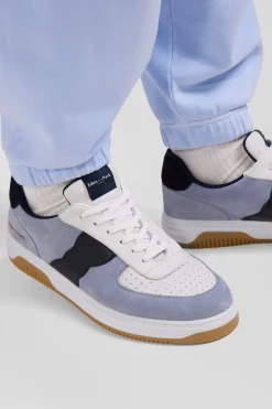 Sky blue low-top leather sneakers with navy blue cut-out