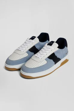 Sky blue low-top leather sneakers with navy blue cut-out