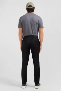 Slim black wool trousers with broken fold