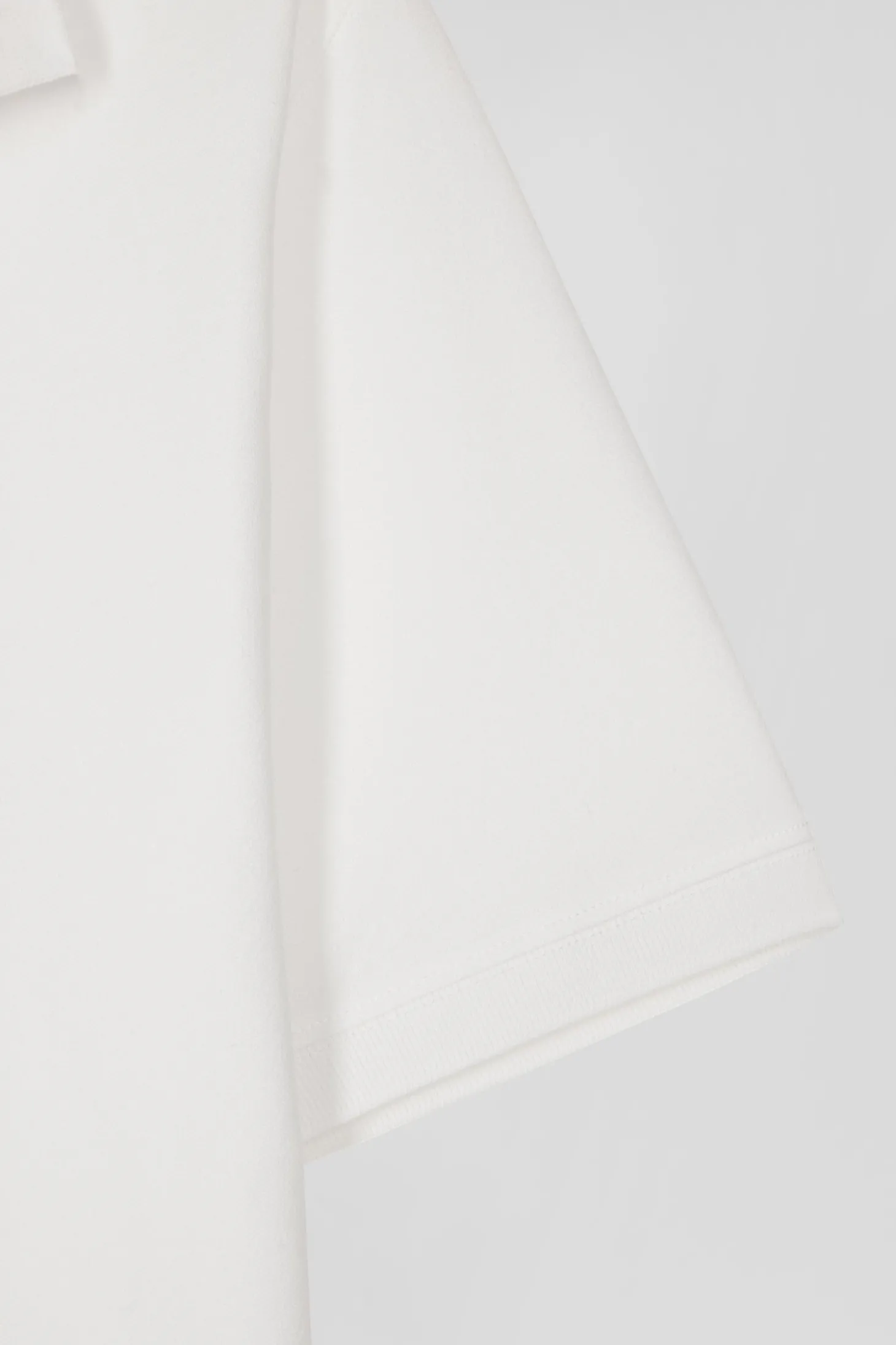 Slim ecru short-sleeved stretch cotton polo shirt